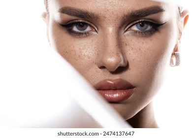 Portrait of a young woman with heterochromia. Blue and brown eyes. Beauty portret - Powered by Shutterstock