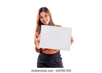 Portrait of young woman holding empty blank board with clipping path on white background. Asian woman displaying white banner. Your text here