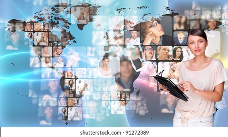 Portrait of young woman holding her tablet computer and communicating with her friends across the world. Standing against world map with photo of people. International communications concept - Shutterstock ID 91272389