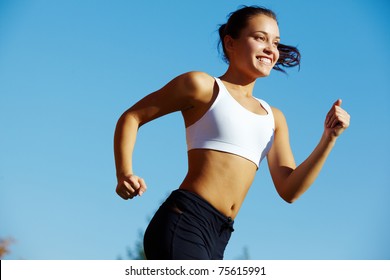 Portrait of a young woman jogging
