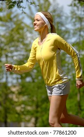 Portrait Of A Young Woman Jogging With A Walkman