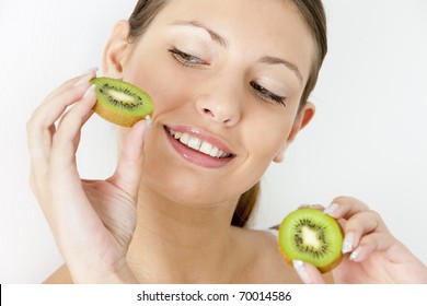 Portrait Of Young Woman With Kiwi
