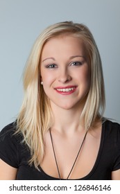 portrait of a young woman with long blond hair in the studio.