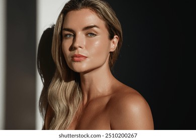 Portrait of  young woman with long blonde hair in sunlight. - Powered by Shutterstock