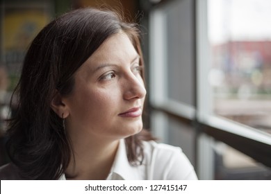 Portrait Of A Young Woman Looking Away From The Camera.