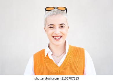 Portrait Of Young Woman Looking At Camera. Close Up Face Of Cheerful Girl Smiling Outdoor. Confident Beautiful Happy Empowered Entrepreneur Shaved Hair Lady