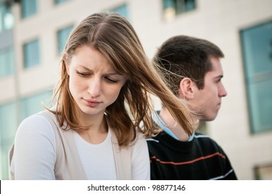 Portrait of young woman and man outdoor on street having relationship problems - Powered by Shutterstock