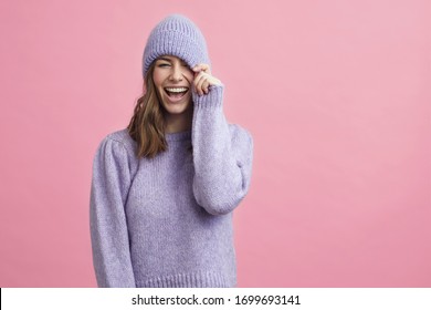 Portrait Of Young Woman In A Nice Winter Sweater That Matches The Background 