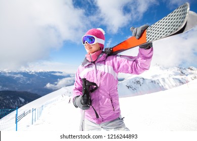 Portrait of young woman on  alpin skii in the  snow mountains