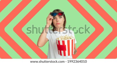 Similar – Image, Stock Photo Cheerful young woman watching a movie