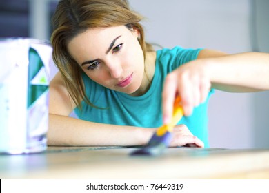 portrait of young woman with painting tools