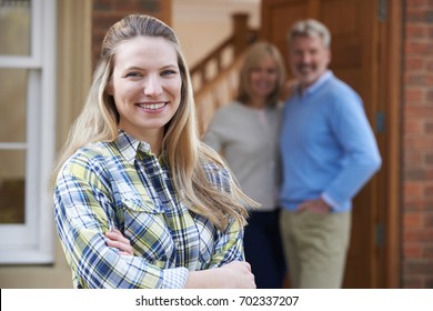 Portrait Of Young Woman With Parents At Home