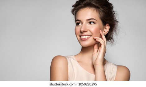 Portrait of young woman with perfect skin beautiful smile and natural make up