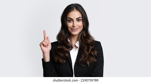 Portrait Of Young Woman Pointing Her Finger In Eureka Sign, Having Great Innovative Idea, Solution Just Got. Female Employee Young Secretary.