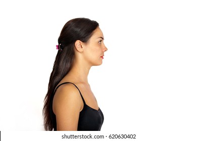 Portrait Of A Young Woman In Profile On A White Background