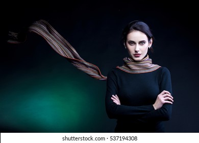 Portrait Of Young Woman, With Scarf Fluttering. Studio Shot