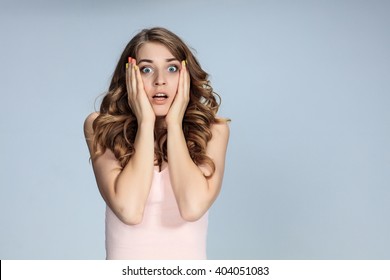 Portrait Of Young Woman With Shocked Facial Expression