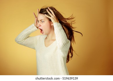 Portrait Of Young Woman With Shocked Facial Expression