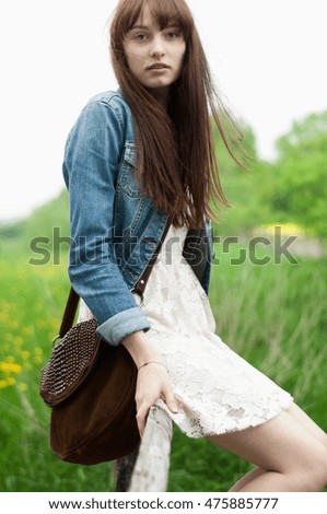 Similar – beautiful young woman smiling while walking in the park