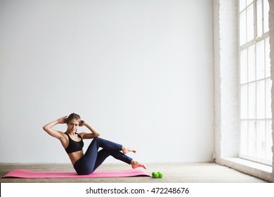 Portrait Of Young Woman In Sportswear, Doing Fitness Exercise With Dumbbell, At Home.