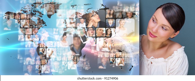 Portrait of young woman standing near big virtual display with world map and lots of photo on it. Network concept