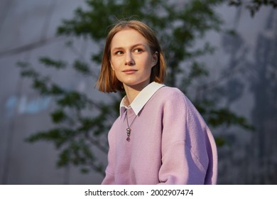 Portrait Of Young Woman Student Near University Building. Female Intern Professional Outside Office, Successful Freelancer Feeling Confident And Happy,