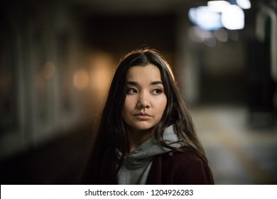 Portrait Of Young Woman In Subway. Night Time