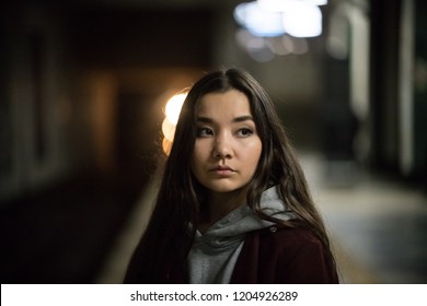 Portrait Of Young Woman In Subway. Night