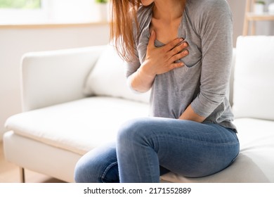 Portrait Of A Young  Woman Suffering From Chest Pain - Powered by Shutterstock