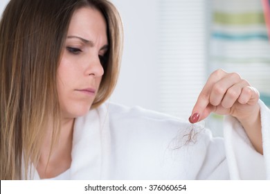 Portrait Of A Young Woman Suffering From Hairloss