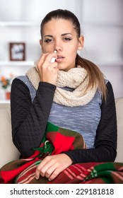 Portrait Of Young Woman Is Using Nose Spray.