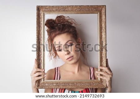 portrait of young woman in a vintage frame