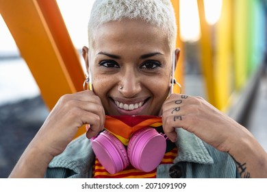 Portrait Of Young Woman Wearing Gay Pride Mask Symbol Of LGBTQ Social Community