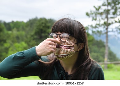 Portrait Of Young Woman Wearing Protective Mask And Holding Her Nose As Sign Of Bad Air Under The Mask. Wearing  Protective Hygienic Face Medical Mask To Prevent Flu Infection, 2019-nCoV, Coronavirus