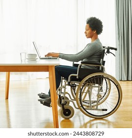 Portrait of a young woman in wheelchair using laptop at home office or in hospital, person with chronic health condition, woman with disability, people with paraplegia - Powered by Shutterstock