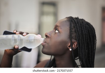 portrait of young woman while drinking water - Shutterstock ID 2170371557