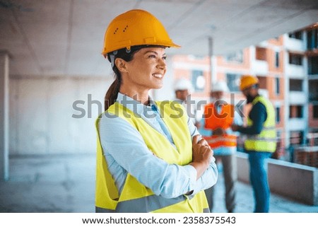 Portrait of a young woman working at a construction site. Portrait of proud engineer woman. Portrait Of Woman Architect On Construction Site. Successful confident architect at construction site 