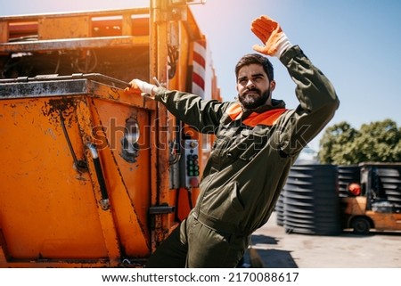 Portrait of a young worker of the city utility company. Garbage collector.