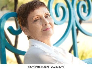 Portraits Of Attractive Woman With Short Hair 50 Years In The Park