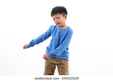 Portraits of a happy Asian boy dance against a white background.