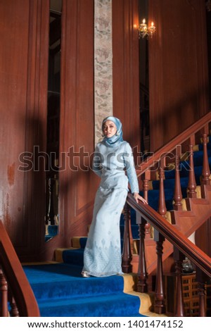 Portraiture of a beautiful female model wearing traditional dress. Eid Ul Fitr fashion.