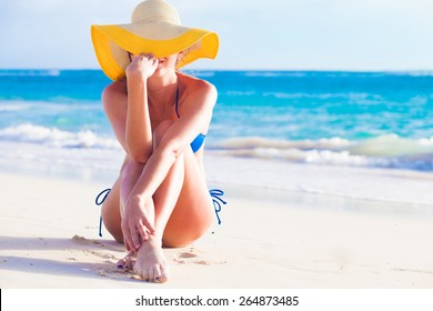 Portrit Of Young Woman In Sun Hat At Beach