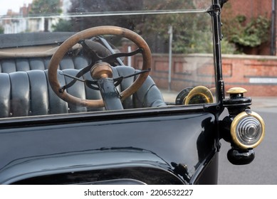 Portsmouth, England, September 25th 2022. Classic Model T Ford Car Parked On A Residential Street In England. Showing Details Of The Steering Wheel, Horn And Lamp