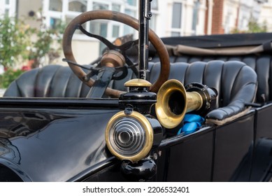 Portsmouth, England, September 25th 2022. Classic Model T Ford Car Parked On A Residential Street In England. Showing Details Of The Steering Wheel, Horn And Lamp