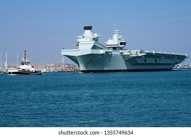 Portsmouth, Hampshire, UK April 1 2019 Royal Navy Aircraft Carrier HMS Queen Elizabeth Leaving Port En Route To Rosyth, Scotland For Routine Maintenance