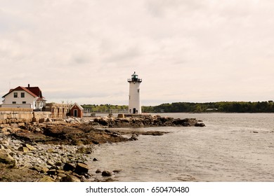 Portsmouth Harbor Lighthouse on a cloudy day. The lighthouse is a historic lighthouse located within Fort Constitution in New Castle, New Hampshire, United States.