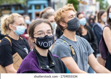Portsmouth, New Hampshire (USA) - June 7th, 2020).  Thousands gathered at Market Square to request justice for George Floyd. A woman is wearing a mask "VOTE"