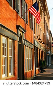 Portsmouth, NH, USA July 14 The Brick,  Facades Of Historic Portsmouth, New Hampshire Line The Main Street, Donning The American Flag