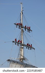 PORTSMOUTH, UK – 12TH AUG 2022: Crew Of The Royal Oman Navy’s Three Mast Square Rigged Clipper SHABAB OMAN II Man The Rigging As The Ship Enters Harbour