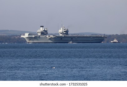 PORTSMOUTH, UK – 15TH MAY 2020: The Royal Navy Aircraft Carrier HMS QUEEN ELIZABETH Weighs Anchor And Heads Through The Solent To Continue Its Trials And Training Programme